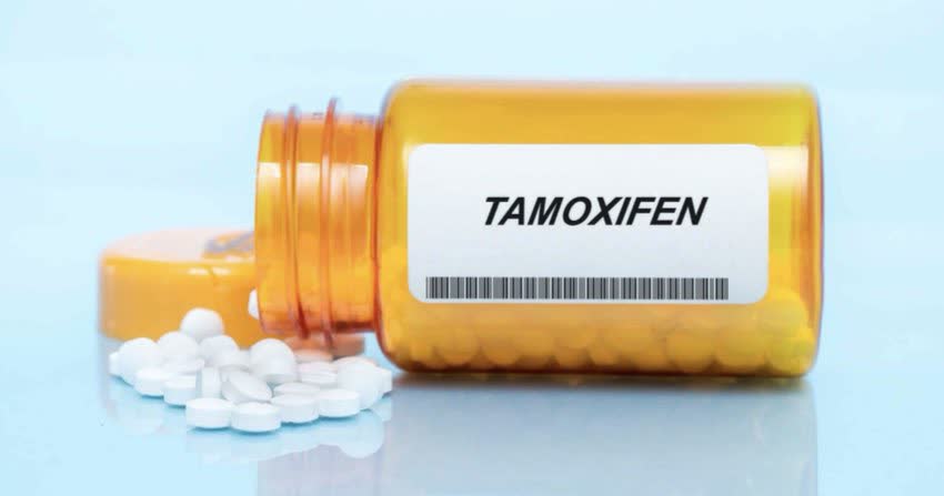 Boccina gialla di vetro contenente pastiglie di Tamoxifene